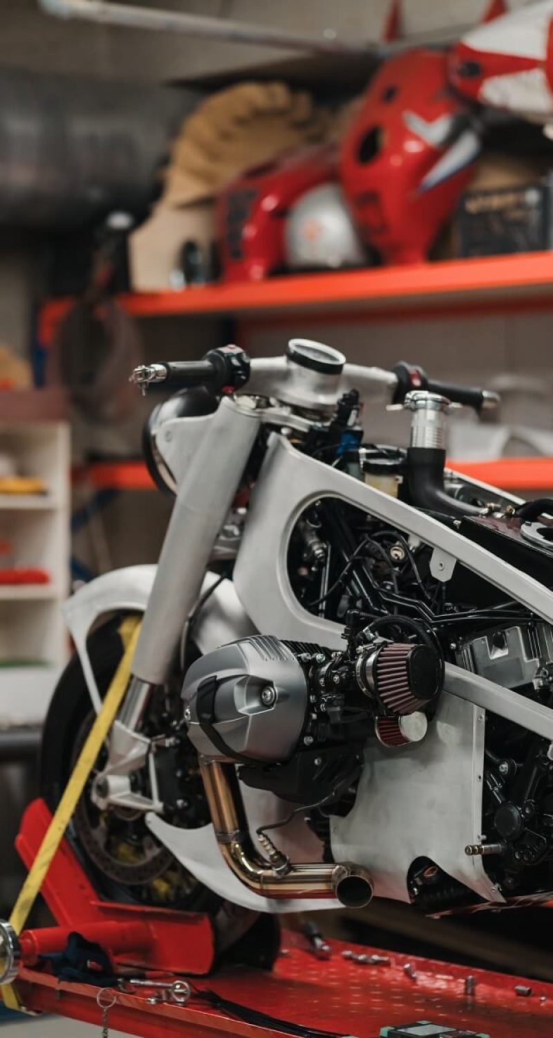 custom-motorcycle-standing-in-repair-shop-FA7CWJW.jpg